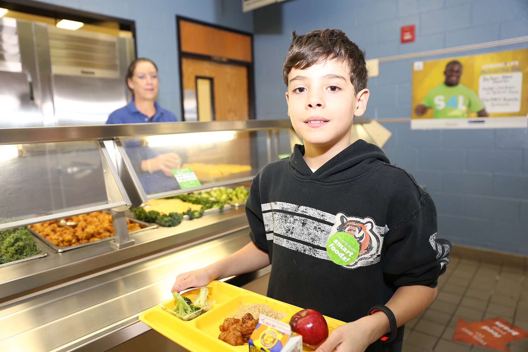 Student holding lunch tray